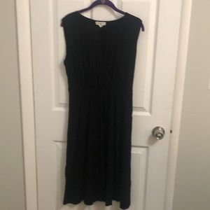 Black spandex knee length dress with pockets.